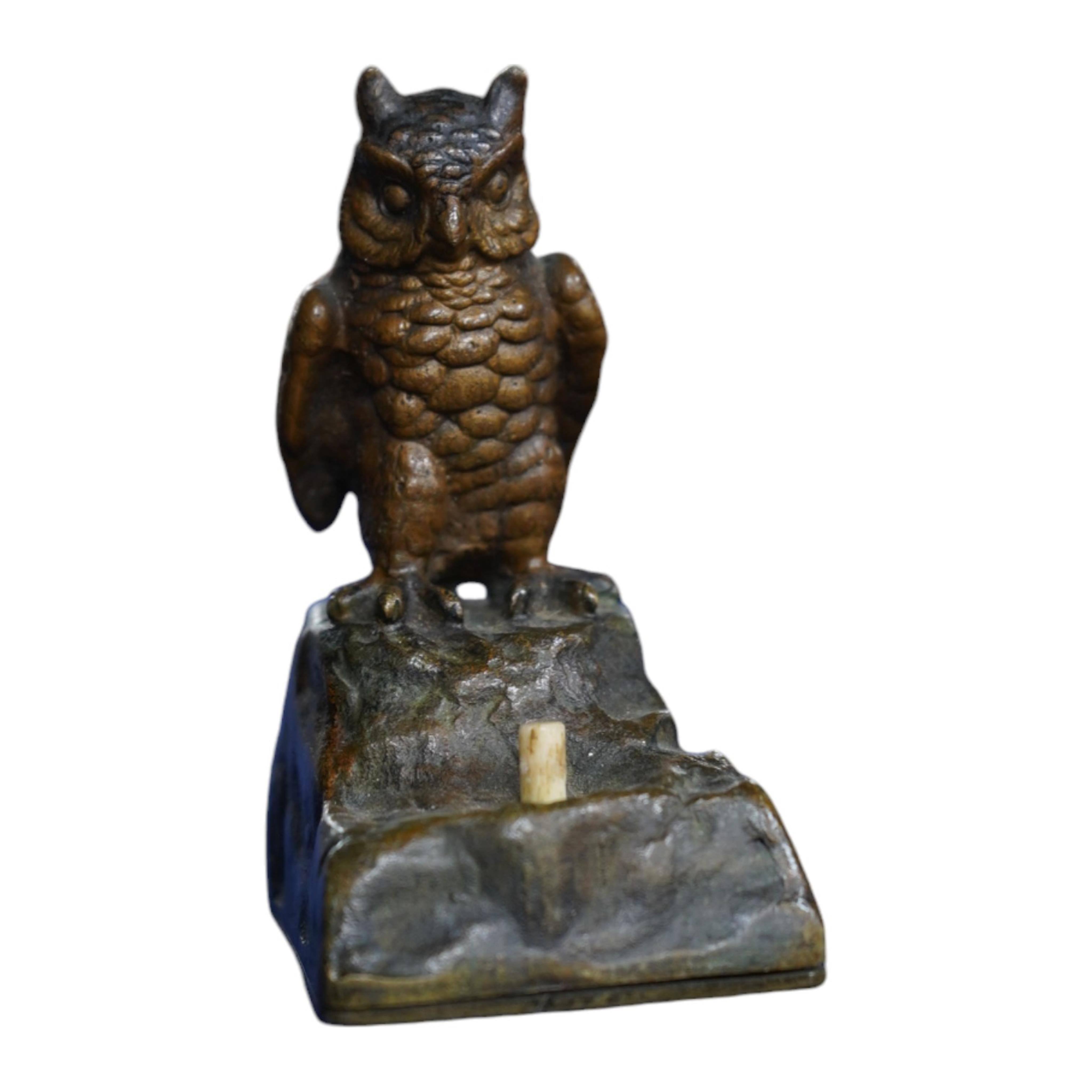 An Austrian cold painted bronze bellpush modelled as a perched owl, 7.5cm high. Condition - fair.